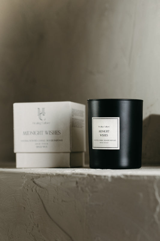 Midnight Wishes candle in dark glass jar by Healing Culture — cinnamon, ginger, and vanilla fragrance.