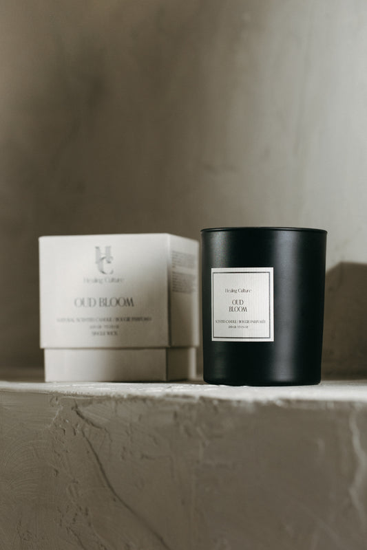 Oud Bloom candle in black glass vessel by Healing Culture — rose, oud, and saffron blend.